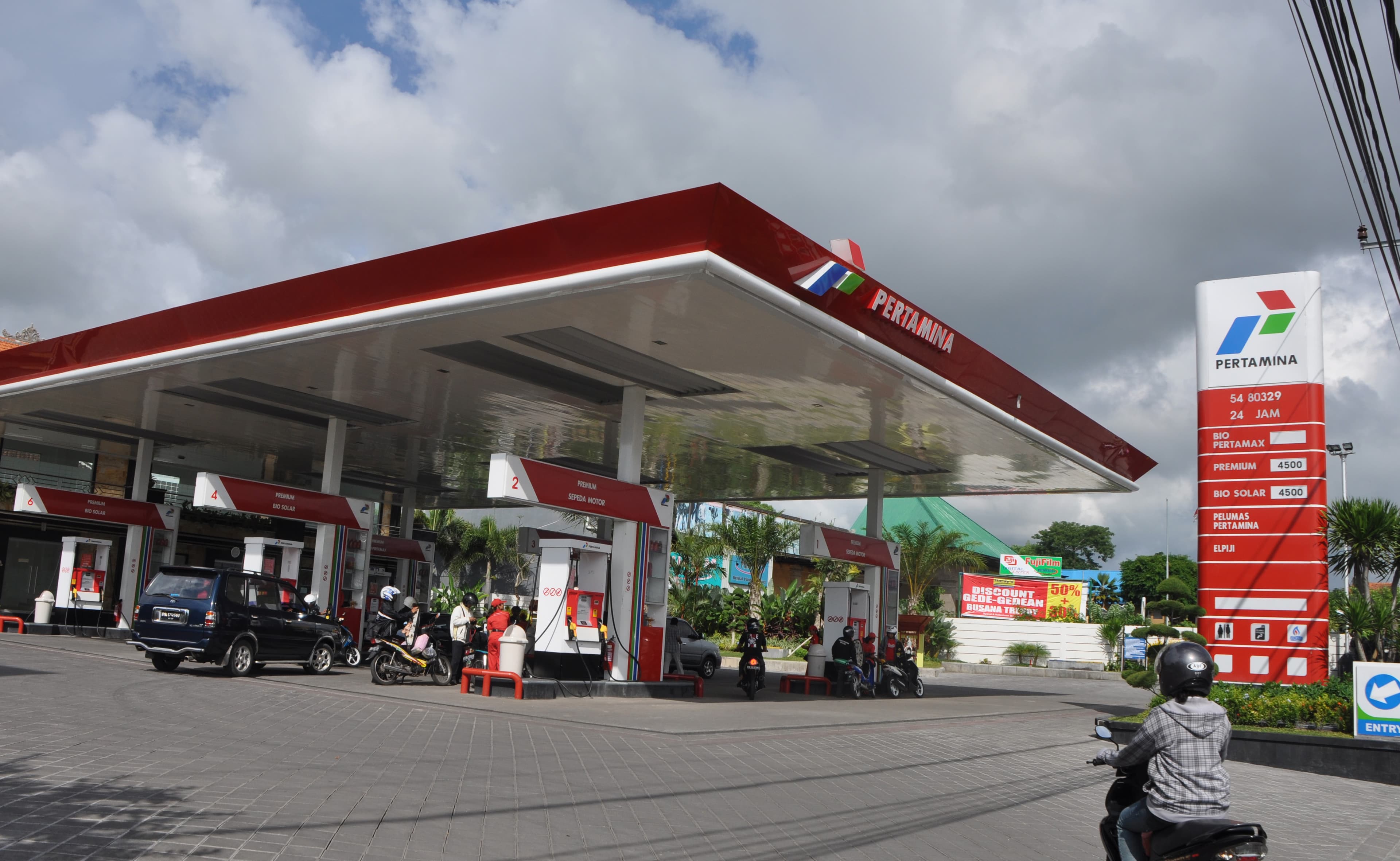 Pertamina signage and pumps at a filling station on Bali, Indonesia.