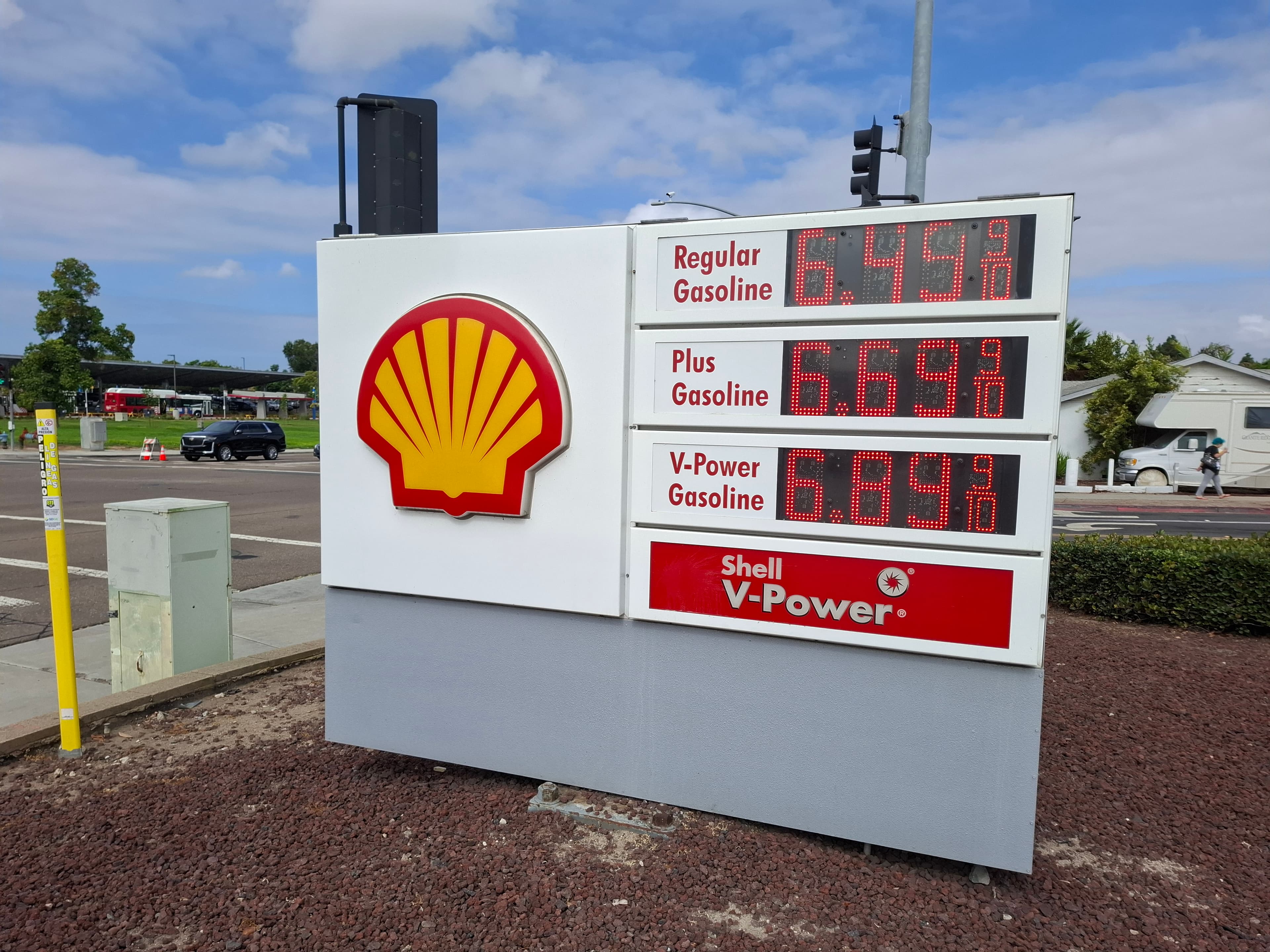A Shell gasoline price board beside a street in Chula Vista, California.