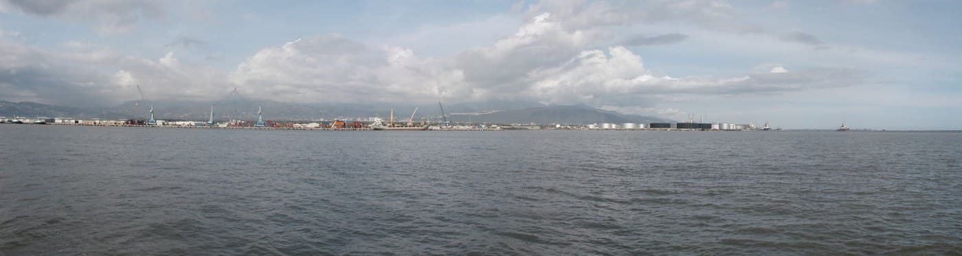 Cranes, warehouses and storage tanks along Kingston Harbour in Jamaica